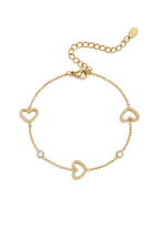 Load image into Gallery viewer, Een armband met hartjes en siersteentjes, leuk cadeautje voor een vriendschap. Verkrijgbaar in goudkleurig, bestel nu.
