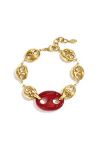 Load image into Gallery viewer, Deze elegante goudkleurige schakel armband met prachtige 'bean’ in bordeaux rood is een echte blikvanger. Langte: 19cm + 3cm + 2cm
