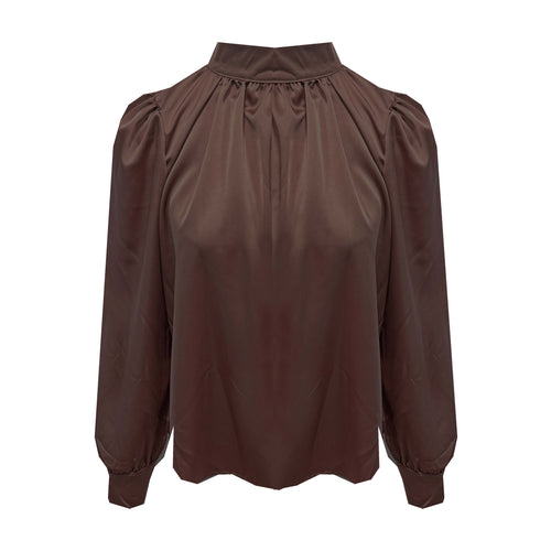 Bruine Glanzende Satijnen Blouse met Pofschouders en Hoge Kraag.
Elegante blouse van glanzende satijnstof met vrouwelijke pofschouders, een chique hoge kraag en twee knoopjes in de nek. De soepelvallende stof geeft een luxe uitstraling en voelt zacht aan op de huid. Perfect te combineren met een rok of pantalon voor een stijlvolle kantoorlook of een feestelijke outfit.