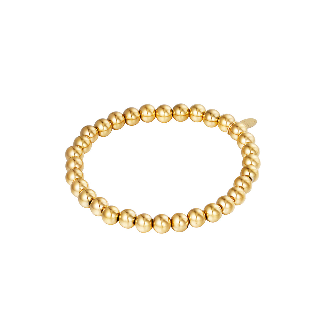 Armband Big Beads is van elastiek en heeft grote ronde beads kralen. De lengte van de armband is 17cm, in goudkleurig stainless steel.